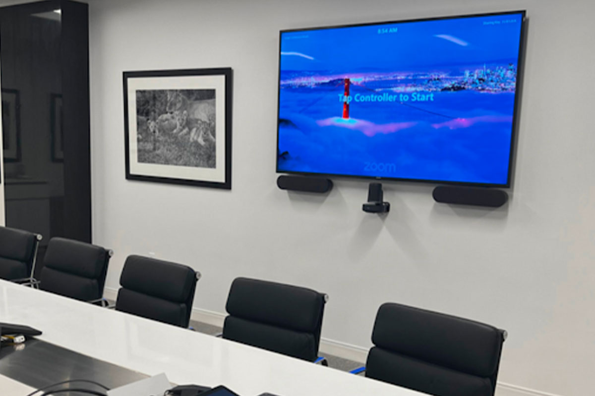 A conference room with a computer monitor on the wall installed with network cabling in Long Island.