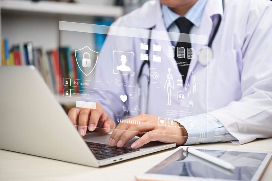 doctor complying with HIPPA 2026 guidelines when inputing patient information